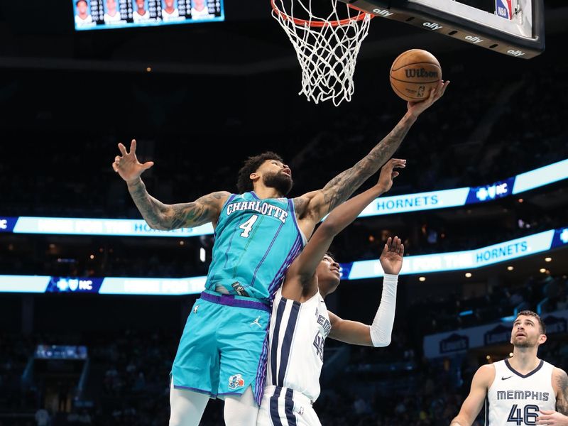 CHARLOTTE, NC - FEBRUARY 10:  Nick Richards #4 of the Charlotte Hornets grabs the rebound during the game on February 10, 2024 at Spectrum Center in Charlotte, North Carolina. NOTE TO USER: User expressly acknowledges and agrees that, by downloading and or using this photograph, User is consenting to the terms and conditions of the Getty Images License Agreement.  Mandatory Copyright Notice:  Copyright 2024 NBAE (Photo by Brock Williams-Smith/NBAE via Getty Images)