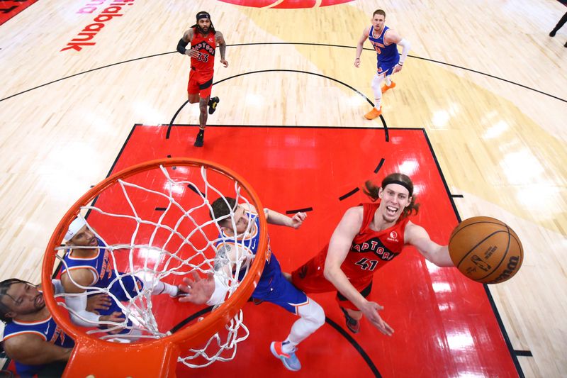 TORONTO, CANADA - MARCH 27: Kelly Olynyk #41 of the Toronto Raptor drives to the basket during the game against the New York Knicks on March 27, 2024 at the Scotiabank Arena in Toronto, Ontario, Canada.  NOTE TO USER: User expressly acknowledges and agrees that, by downloading and or using this Photograph, user is consenting to the terms and conditions of the Getty Images License Agreement.  Mandatory Copyright Notice: Copyright 2024 NBAE (Photo by Vaughn Ridley/NBAE via Getty Images)