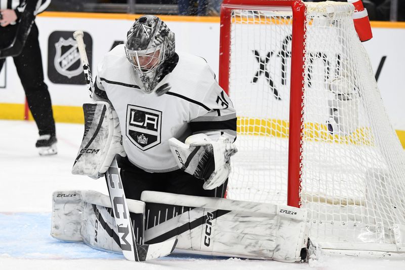 Jan 31, 2024; Nashville, Tennessee, USA; Los Angeles Kings goaltender David Rittich (31) makes a save during the third period against the Nashville Predators at Bridgestone Arena. Mandatory Credit: Christopher Hanewinckel-USA TODAY Sports