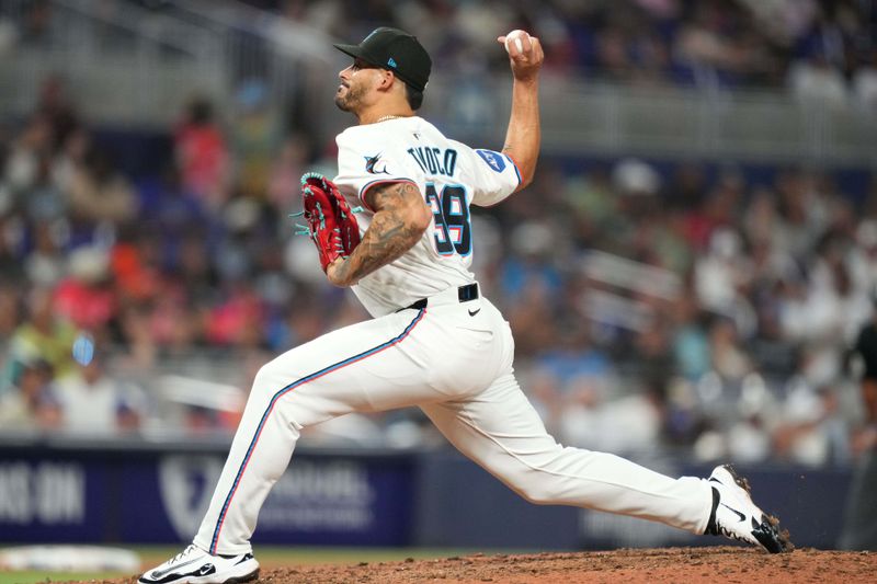 May 6, 2025; Miami, Florida, USA;  Miami Marlins pitcher Jesus Tinoco (38) pitches in the ninth inning against the Los Angeles Dodgers at loanDepot Park. Mandatory Credit: Jim Rassol-Imagn Images