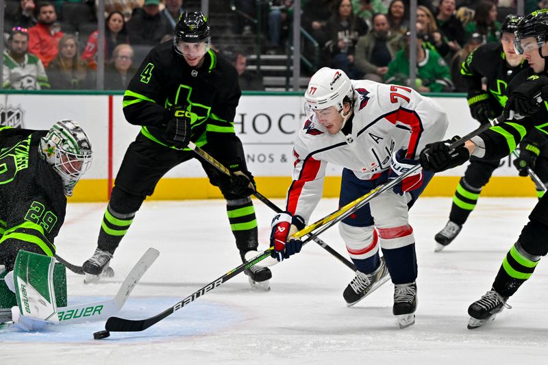 Jan 27, 2024; Dallas, Texas, USA; Dallas Stars goaltender Jake Oettinger (29) turns aside a shot by Washington Capitals right wing T.J. Oshie (77) during the third period at the American Airlines Center. Mandatory Credit: Jerome Miron-USA TODAY Sports