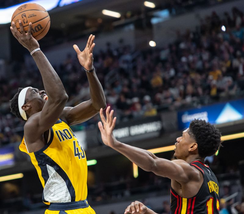 INDIANAPOLIS, INDIANA - APRIL 14: Pascal Siakam #43 of the Indiana Pacers shoots the ball against De'Andre Hunter #12 of the Atlanta Hawks during the second half at Gainbridge Fieldhouse on April 14, 2024 in Indianapolis, Indiana. NOTE TO USER: User expressly acknowledges and agrees that, by downloading and or using this photograph, User is consenting to the terms and conditions of the Getty Images License Agreement. (Photo by Michael Hickey/Getty Images)