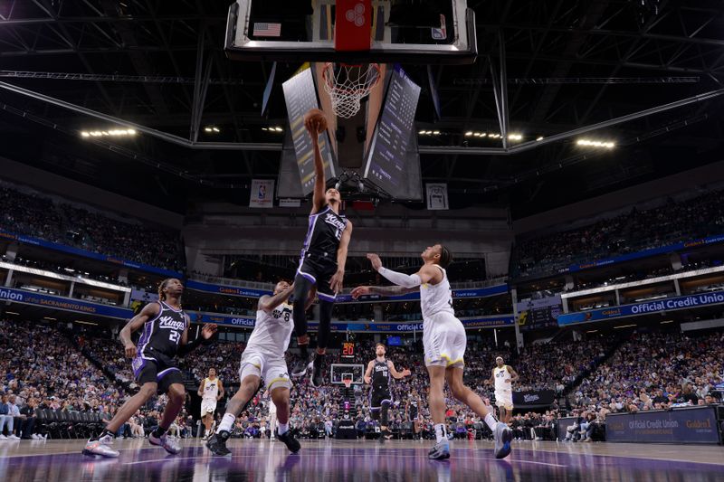 SACRAMENTO, CA - MARCH 31: Keegan Murray #13 of the Sacramento Kings drives to the basket during the game against the Utah Jazz on March 31, 2024 at Golden 1 Center in Sacramento, California. NOTE TO USER: User expressly acknowledges and agrees that, by downloading and or using this Photograph, user is consenting to the terms and conditions of the Getty Images License Agreement. Mandatory Copyright Notice: Copyright 2024 NBAE (Photo by Rocky Widner/NBAE via Getty Images)