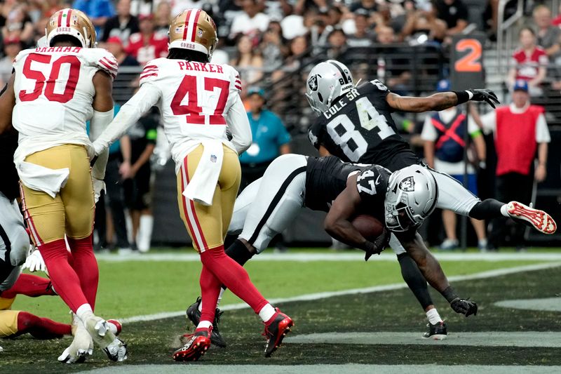 Las Vegas Raiders running back Sincere McCormick (47) scores a touchdown against the San Francisco 49ers during the second half of an NFL preseason football game, Sunday, Aug. 13, 2023, in Las Vegas. (AP Photo/John Locher)