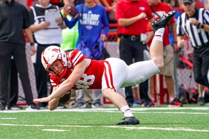 Sep 23, 2023; Lincoln, Nebraska, USA; Nebraska Cornhuskers place kicker Timmy Bleekrode (38) dives forward on a fake field goal against the Louisiana Tech Bulldogs during the second quarter at Memorial Stadium. Mandatory Credit: Dylan Widger-USA TODAY Sports