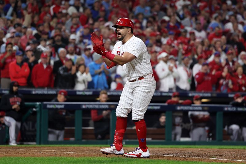 Oct 24, 2023; Philadelphia, Pennsylvania, USA; Philadelphia Phillies left fielder Kyle Schwarber (12) reacts after drawing a walk against the Arizona Diamondbacks in the seventh inning for game seven of the NLCS for the 2023 MLB playoffs at Citizens Bank Park. Mandatory Credit: Bill Streicher-USA TODAY Sports