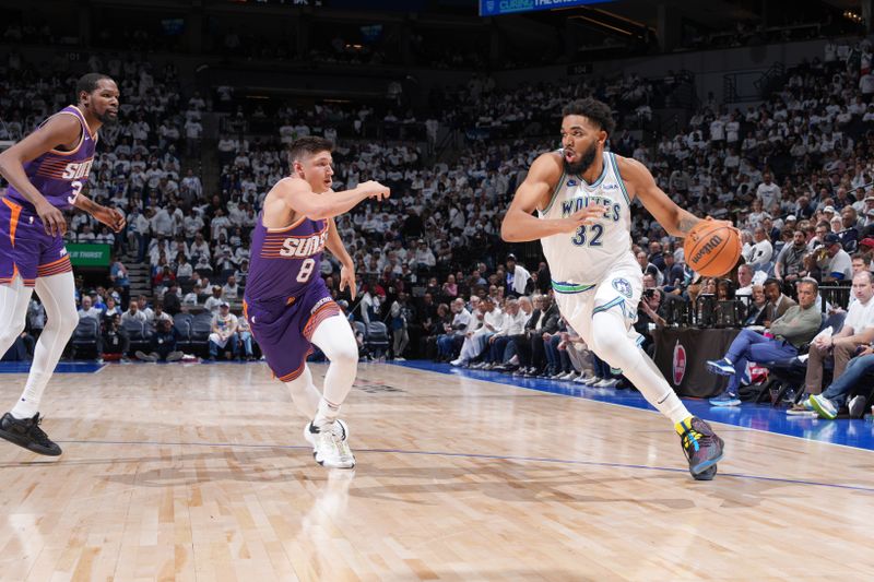 MINNEAPOLIS, MN -  APRIL 20: Karl-Anthony Towns #32 of the Minnesota Timberwolves drives to the basket during Round One Game One of the 2024 NBA Playoffs against the Phoenix Suns on April 20, 2024 at Target Center in Minneapolis, Minnesota. NOTE TO USER: User expressly acknowledges and agrees that, by downloading and or using this Photograph, user is consenting to the terms and conditions of the Getty Images License Agreement. Mandatory Copyright Notice: Copyright 2024 NBAE (Photo by Jordan Johnson/NBAE via Getty Images)