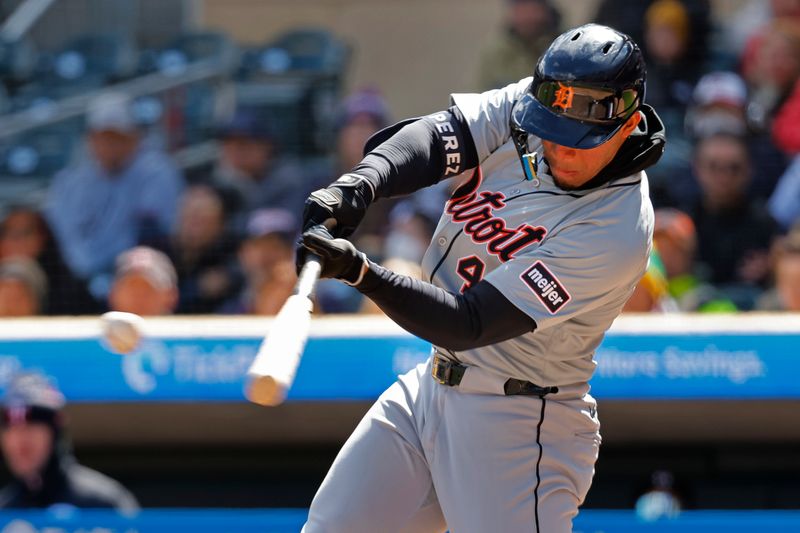 Apr 20, 2024; Minneapolis, Minnesota, USA; Detroit Tigers right fielder Wenceel Perez (46) hits an RBI triple against the Minnesota Twins in the sixth inning at Target Field. Mandatory Credit: Bruce Kluckhohn-USA TODAY Sports