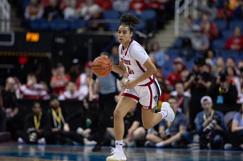 Mar 9, 2024; Greensboro, NC, USA; NC State Wolfpack guard Madison Hayes (21) brings the ball up court against the Florida State Seminoles during the second half at Greensboro Coliseum. Mandatory Credit: David Yeazell-USA TODAY Sports