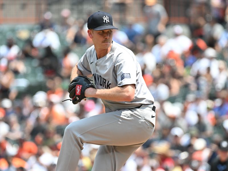 Jul 14, 2024; Baltimore, Maryland, USA;  New York Yankees pitcher Michael Tonkin (50) delivers a sixth inning pitch against the Baltimore Orioles at Oriole Park at Camden Yards. Mandatory Credit: James A. Pittman-USA TODAY Sports