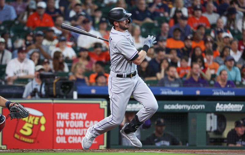 Jul 4, 2023; Houston, Texas, USA; Colorado Rockies designated hitter Kris Bryant (23) hits a single during the first inning against the Houston Astros at Minute Maid Park. Mandatory Credit: Troy Taormina-USA TODAY Sports