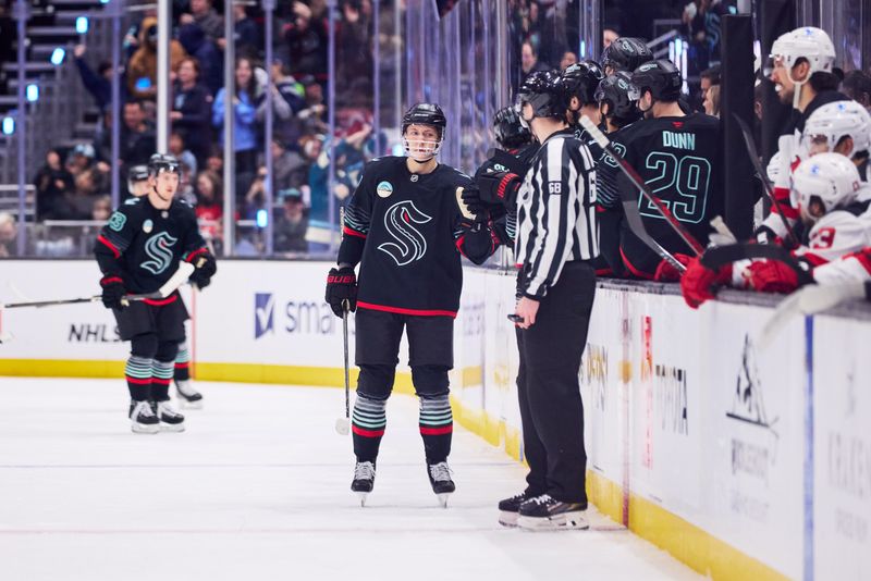 Jan 25, 2026; Seattle, Washington, USA;  Seattle Kraken defenseman Ryker Evans (41) celebrates after scoring a goal during the second period against the New Jersey Devils at Climate Pledge Arena. Mandatory Credit: Blake Dahlin-Imagn Images