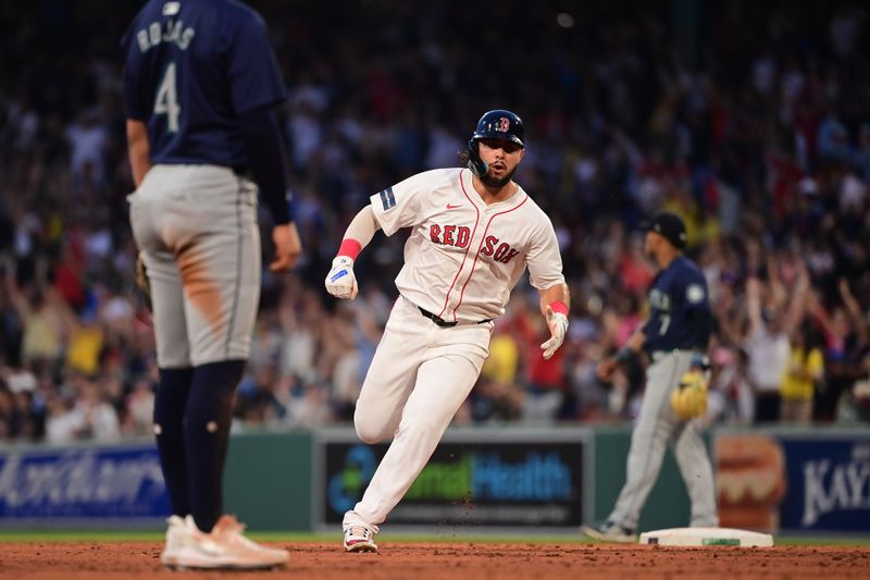 Jul 29, 2024; Boston, Massachusetts, USA; Boston Red Sox right fielder Wilyer Abreu (52)  scores on a two run home run by designated hitter Masataka Yoshida (7) (not pictured)during the third inning against the Seattle Mariners at Fenway Park. Mandatory Credit: Eric Canha-USA TODAY Sports