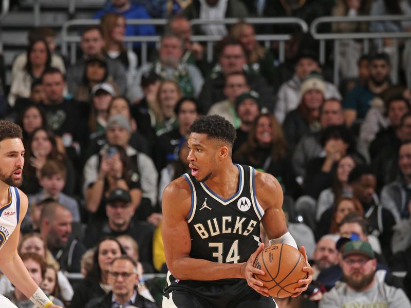 MILWAUKEE, WI - JANUARY 13: Giannis Antetokounmpo #34 of the Milwaukee Bucks looks to pass the ball during the game against the Golden State Warriors on January 13, 2024 at the Fiserv Forum Center in Milwaukee, Wisconsin. NOTE TO USER: User expressly acknowledges and agrees that, by downloading and or using this Photograph, user is consenting to the terms and conditions of the Getty Images License Agreement. Mandatory Copyright Notice: Copyright 2024 NBAE (Photo by Gary Dineen/NBAE via Getty Images).