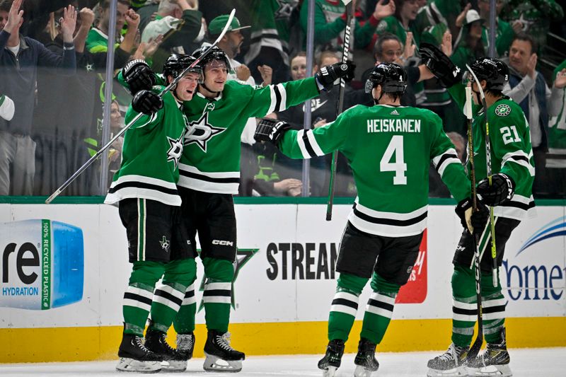 Dec 21, 2023; Dallas, Texas, USA; Dallas Stars defenseman Thomas Harley (55) and center Roope Hintz (24) and defenseman Miro Heiskanen (4) and left wing Jason Robertson (21) celebrate after Harley scores the game tying goal against the Vancouver Canucks during the third period at the American Airlines Center. Mandatory Credit: Jerome Miron-USA TODAY Sports