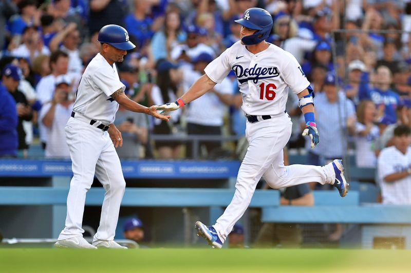 Jun 25, 2023; Los Angeles, California, USA; Los Angeles Dodgers catcher Will Smith (16) is greeted by third base coach Dino Ebel (91) after hitting a two run home run against the Houston Astros during the eighth inning at Dodger Stadium. Mandatory Credit: Gary A. Vasquez-USA TODAY Sports