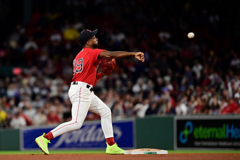 Sep 14, 2023; Boston, Massachusetts, USA; Boston Red Sox second baseman Pablo Reyes (19) throws to first base during the sixth inning at Fenway Park. Mandatory Credit: Eric Canha-USA TODAY Sports