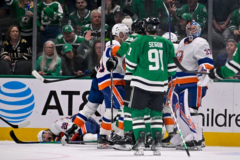 Nov 18, 2025; Dallas, Texas, USA; Dallas Stars right wing Mikko Rantanen (96) is called for a game misconduct penalty for boarding on New York Islanders defenseman Alexander Romanov (28) during the third period at the American Airlines Center. Mandatory Credit: Jerome Miron-Imagn Images