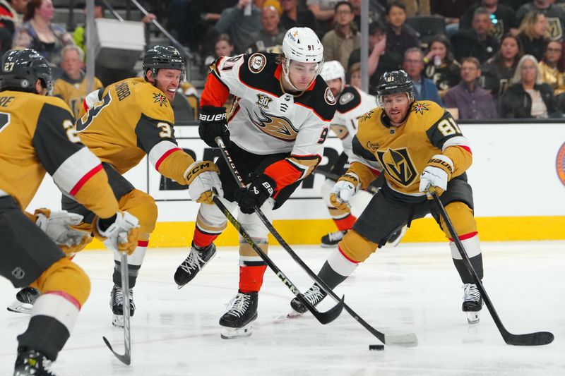 Apr 18, 2024; Las Vegas, Nevada, USA; Anaheim Ducks center Leo Carlsson (91) controls the puck between Vegas Golden Knights defenseman Brayden McNabb (3) and right wing Jonathan Marchessault (81) during the first period at T-Mobile Arena. Mandatory Credit: Stephen R. Sylvanie-USA TODAY Sports