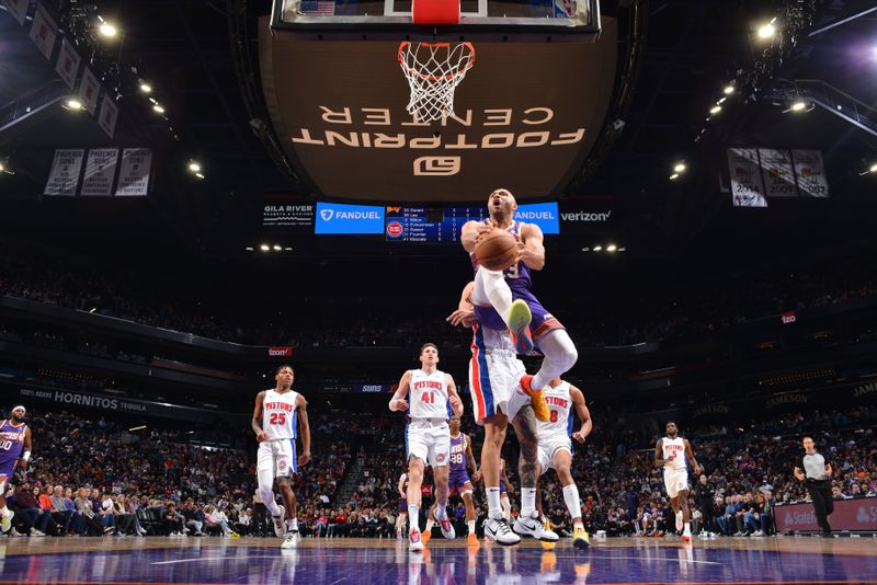 PHOENIX, AZ - FEBRUARY 14:  Eric Gordon #23 of the Phoenix Suns handles the ball during the game against the Detroit Pistons on February 14, 2024 at Footprint Center in Phoenix, Arizona. NOTE TO USER: User expressly acknowledges and agrees that, by downloading and or using this photograph, user is consenting to the terms and conditions of the Getty Images License Agreement. Mandatory Copyright Notice: Copyright 2024 NBAE (Photo by Barry Gossage/NBAE via Getty Images)