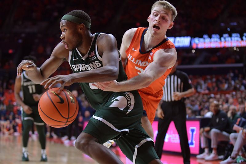 Jan 11, 2024; Champaign, Illinois, USA;  Michigan State Spartans guard Tre Holloman (5) drives with the ball as Illinois Fighting Illini guard Marcus Domask (3) reaches in during the second half at State Farm Center. Mandatory Credit: Ron Johnson-USA TODAY Sports