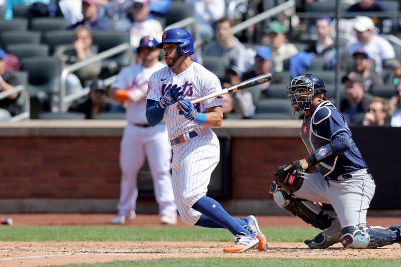 May 18, 2023; New York City, New York, USA; New York Mets left fielder Tommy Pham (28) follows through on an RBI infield single against the Tampa Bay Rays during the sixth inning at Citi Field. Mandatory Credit: Brad Penner-USA TODAY Sports