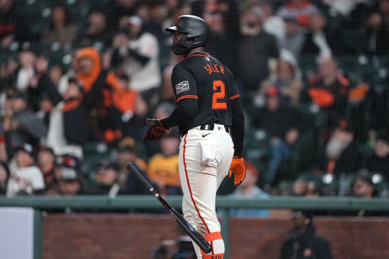 Apr 27, 2024; San Francisco, California, USA; San Francisco Giants designated hitter Jorge Soler (2) drops his bat after hitting a home run against the Pittsburgh Pirates during the tenth inning at Oracle Park. Mandatory Credit: Darren Yamashita-USA TODAY Sports