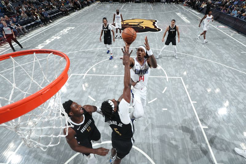 MEMPHIS, TN - FEBRUARY 23: Terance Mann #14 of the LA Clippers shoots the ball during the game against the Memphis Grizzlies on February 23, 2024 at FedExForum in Memphis, Tennessee. NOTE TO USER: User expressly acknowledges and agrees that, by downloading and or using this photograph, User is consenting to the terms and conditions of the Getty Images License Agreement. Mandatory Copyright Notice: Copyright 2024 NBAE (Photo by Joe Murphy/NBAE via Getty Images)