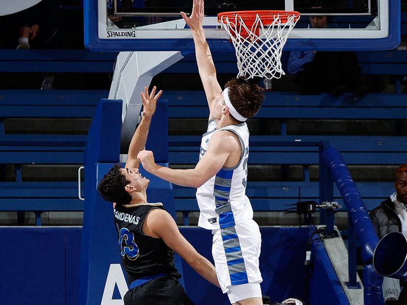 Mar 4, 2023; Colorado Springs, Colorado, USA; San Jose State Spartans guard Alvaro Cardenas (13) drives to the net against Air Force Falcons guard Camden Vander Zwaag (30) in the second half at Clune Arena. Mandatory Credit: Isaiah J. Downing-USA TODAY Sports