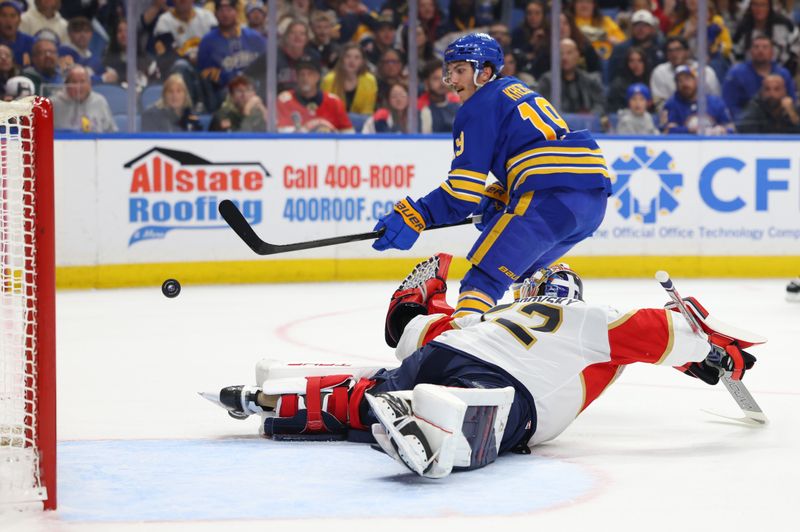 Oct 18, 2025; Buffalo, New York, USA;  Florida Panthers goaltender Sergei Bobrovsky (72) dives to try and make a save on Buffalo Sabres center Peyton Krebs (19) during the second period at KeyBank Center. Mandatory Credit: Timothy T. Ludwig-Imagn Images