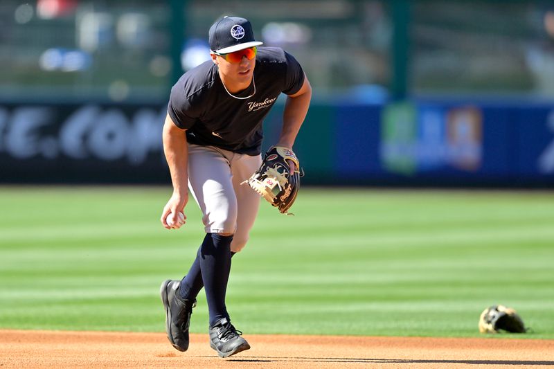 May 29, 2024; Anaheim, California, USA;  New York Yankees shortstop Anthony Volpe (11) warms up prior to the game against the Los Angeles Angels at Angel Stadium. Mandatory Credit: Jayne Kamin-Oncea-USA TODAY Sports