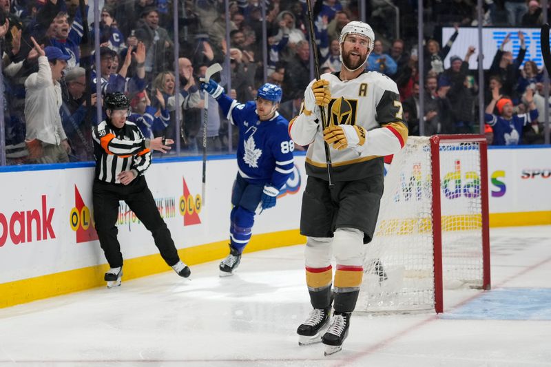 Nov 20, 2024; Toronto, Ontario, CAN; Vegas Golden Knights defenseman Alex Pietrangelo (7) reacts after a goal by Toronto Maple Leafs forward William Nylander (88) during the third period at Scotiabank Arena. Mandatory Credit: John E. Sokolowski-Imagn Images