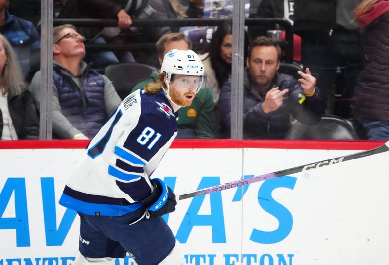 Dec 7, 2023; Denver, Colorado, USA; Winnipeg Jets left wing Kyle Connor (81) celebrates his goal in the third period against the Colorado Avalanche at Ball Arena. Mandatory Credit: Ron Chenoy-USA TODAY Sports