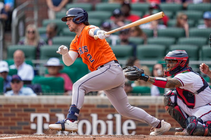 Apr 23, 2023; Cumberland, Georgia, USA; Houston Astros third baseman Alex Bregman (2) singles to drive in two runs against the Atlanta Braves during the ninth inning at Truist Park. Mandatory Credit: Dale Zanine-USA TODAY Sports