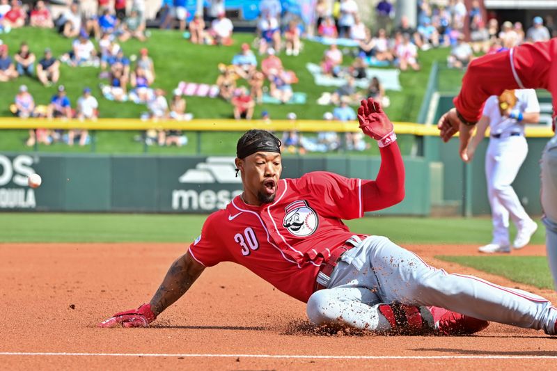 Feb 27, 2024; Mesa, Arizona, USA;  Cincinnati Reds right fielder Will Benson (30) triples in the second inning against the Chicago Cubs during a spring training game at Sloan Park. Mandatory Credit: Matt Kartozian-USA TODAY Sports