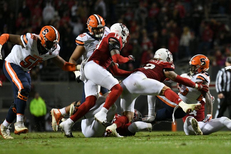 Nov 20, 2021; Raleigh, North Carolina, USA; Syracuse Orange wide receiver Courtney Jackson (85) is tackled by North Carolina State Wolfpack linebacker Drake Thomas (32) during the second half at Carter-Finley Stadium. Mandatory Credit: William Howard-USA TODAY Sports