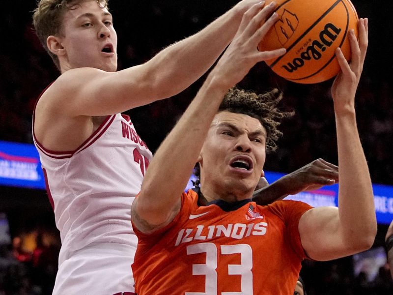 Mar 2, 2024; Madison, WI, USA; Wisconsin forward Nolan Winter (31) fouls Illinois forward Coleman Hawkins (33) during the first half of their game Saturday, March 2, 2024 at the Kohl Center in Madison, Wisconsin.
 Mandatory Credit: Mark Hoffman-USA TODAY Sports