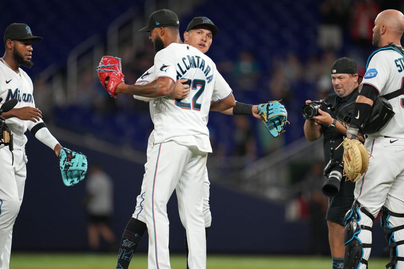 Apr 4, 2023; Miami, Florida, USA;  Miami Marlins starting pitcher Sandy Alcantara (22) gets a hug from right fielder Avisail Garcia (24) after a complete game over the Minnesota Twins at loanDepot Park. Mandatory Credit: Jim Rassol-USA TODAY Sports