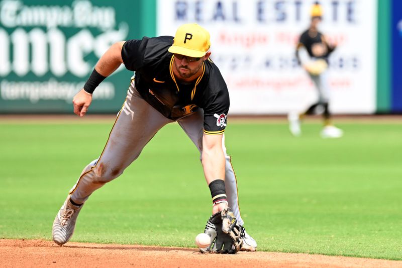 Mar 18, 2024; Clearwater, Florida, USA;  Pittsburgh Pirates second baseman Jared Triolo (19) fields a ground ball in the second inning of the spring training game against the Philadelphia Phillies at BayCare Ballpark. Mandatory Credit: Jonathan Dyer-USA TODAY Sports