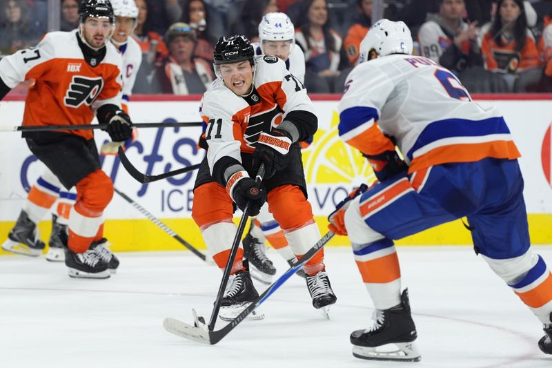 Oct 25, 2025; Philadelphia, Pennsylvania, USA; Philadelphia Flyers right wing Tyson Foerster (71) reaches for the puck against the New York Islanders in the second period at Xfinity Mobile Arena. Mandatory Credit: Kyle Ross-Imagn Images