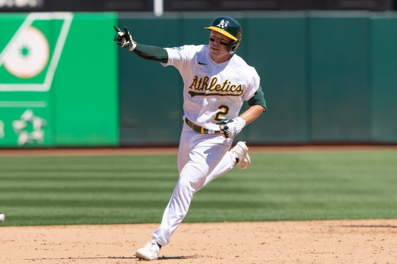 Aug 6, 2023; Oakland, California, USA;  Oakland Athletics shortstop Nick Allen (2) signals after hitting a solo home run, his second home run of the game, during the fifth inning against the San Francisco Giants at Oakland-Alameda County Coliseum. Mandatory Credit: Stan Szeto-USA TODAY Sports