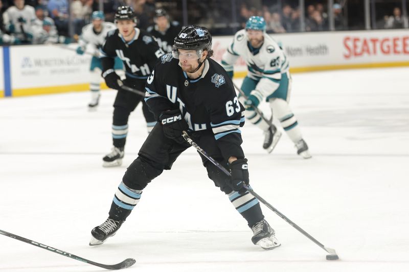 Oct 28, 2024; Salt Lake City, Utah, USA; Utah Hockey Club left wing Matias Maccelli (63) controls the puck during the second period against the San Jose Sharks at Delta Center. Mandatory Credit: Chris Nicoll-Imagn Images