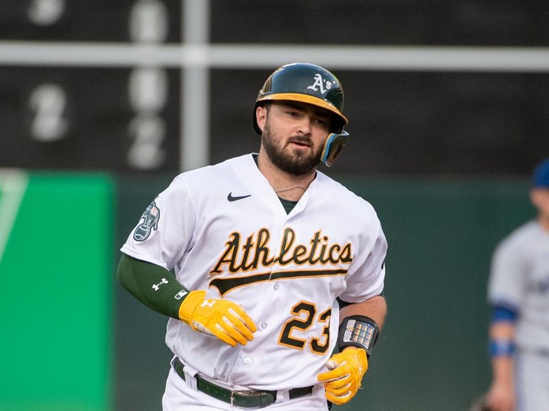 Aug 22, 2023; Oakland, California, USA; Oakland Athletics catcher Shea Langeliers (23) rounds second base after hitting a home run during the second inning against the Kansas City Royals at Oakland-Alameda County Coliseum. Mandatory Credit: Ed Szczepanski-USA TODAY Sports