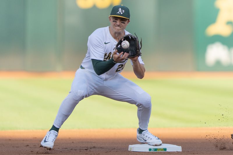 Aug 6, 2024; Oakland, California, USA;  Oakland Athletics second base Zack Gelof (20) catches the ball during the first inning against the Chicago White Sox at Oakland-Alameda County Coliseum. Mandatory Credit: Stan Szeto-USA TODAY Sports