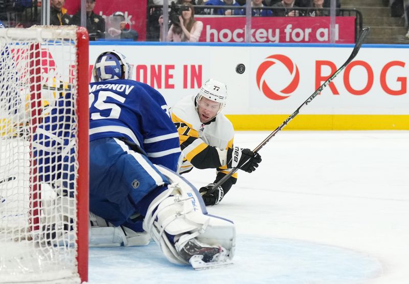 Apr 8, 2024; Toronto, Ontario, CAN; Pittsburgh Penguins center Jeff Carter (77) battles for the puck in front of Toronto Maple Leafs goaltender Ilya Samsonov (35) during the second period at Scotiabank Arena. Mandatory Credit: Nick Turchiaro-USA TODAY Sports