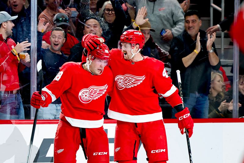 Nov 11, 2023; Detroit, Michigan, USA;  Detroit Red Wings right wing Daniel Sprong (88) celebrates with defenseman Jeff Petry (46) after scoring against the Columbus Blue Jackets in the second period at Little Caesars Arena. Mandatory Credit: Rick Osentoski-USA TODAY Sports