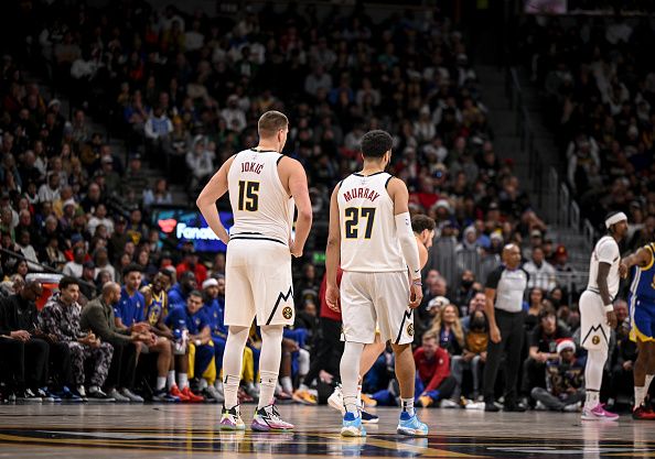 DENVER, CO - DECEMBER 25: Nikola Jokic (15) and Jamal Murray (27) of the Denver Nuggets stand on the court against the Golden State Warriors during the second quarter at Ball Arena in Denver on Monday, December 25, 2023. (Photo by AAron Ontiveroz/The Denver Post)