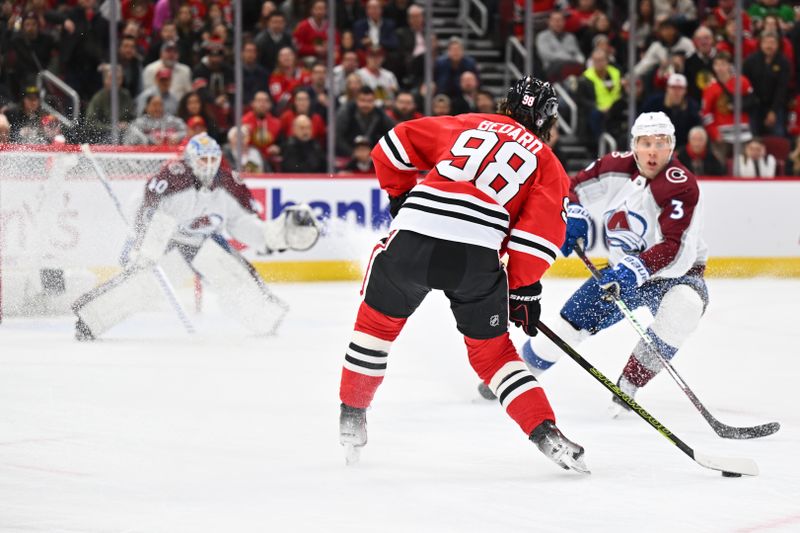 Dec 19, 2023; Chicago, Illinois, USA; Chicago Blackhawks forward Connor Bedard (98) attempts a shot on goal in the first period against the Colorado Avalanche at United Center. Mandatory Credit: Jamie Sabau-USA TODAY Sports