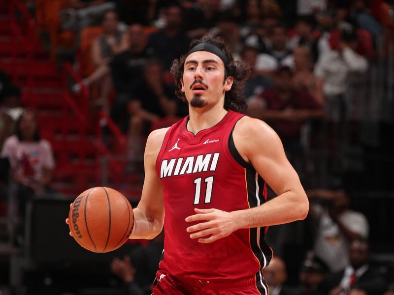 MIAMI, FL - MARCH 10: Jaime Jaquez Jr. #11 of the Miami Heat brings the ball up court during the game against the Washington Wizards on March 10, 2024 at Kaseya Center in Miami, Florida. NOTE TO USER: User expressly acknowledges and agrees that, by downloading and or using this Photograph, user is consenting to the terms and conditions of the Getty Images License Agreement. Mandatory Copyright Notice: Copyright 2024 NBAE (Photo by Issac Baldizon/NBAE via Getty Images)