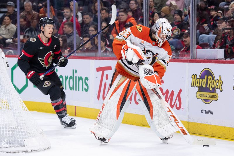 Mar 14, 2026; Ottawa, Ontario, CAN; Anaheim Ducks goalie Ville Husso (33) clears the puck as Ottawa Senators left wing Brady Tkachuk (7) moves in during the first period at the Canadian Tire Centre. Mandatory Credit: Marc DesRosiers-IMAGN Images